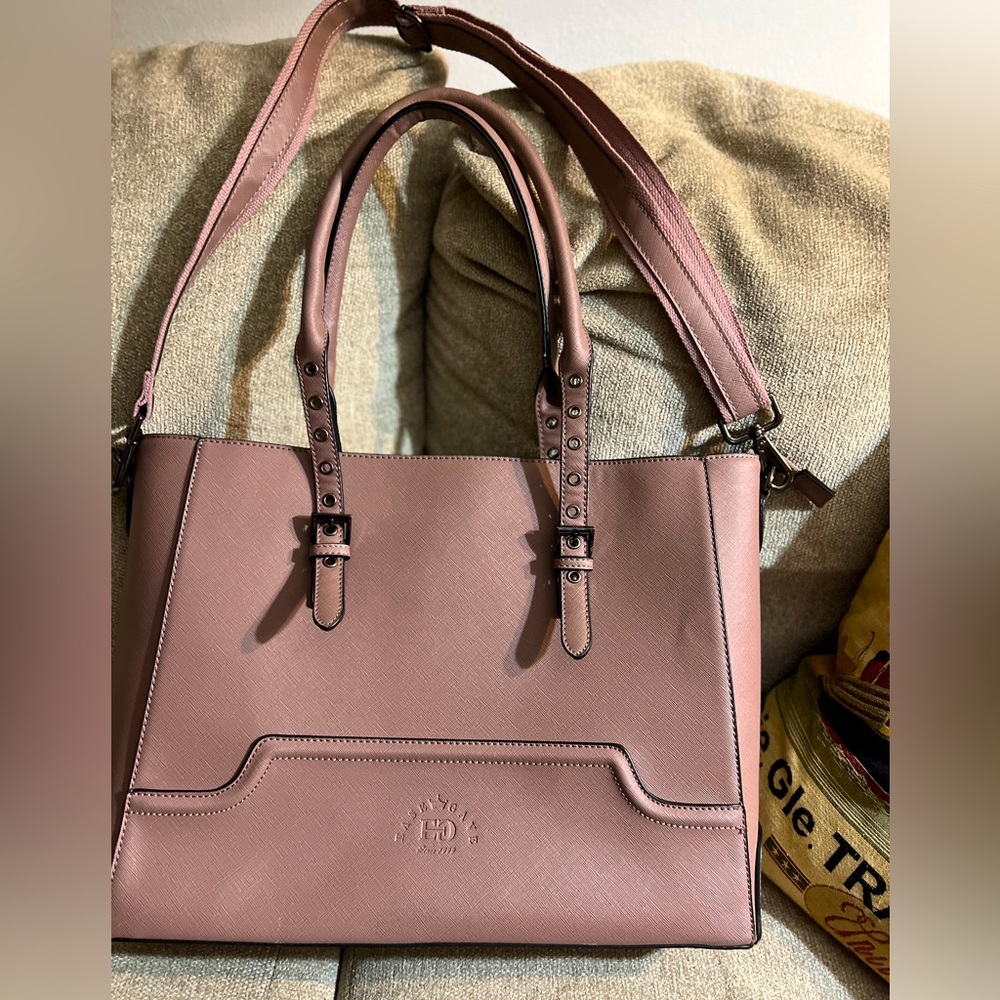 An amazing lap top bag, tote, with strap and removable straps. Tons of room.